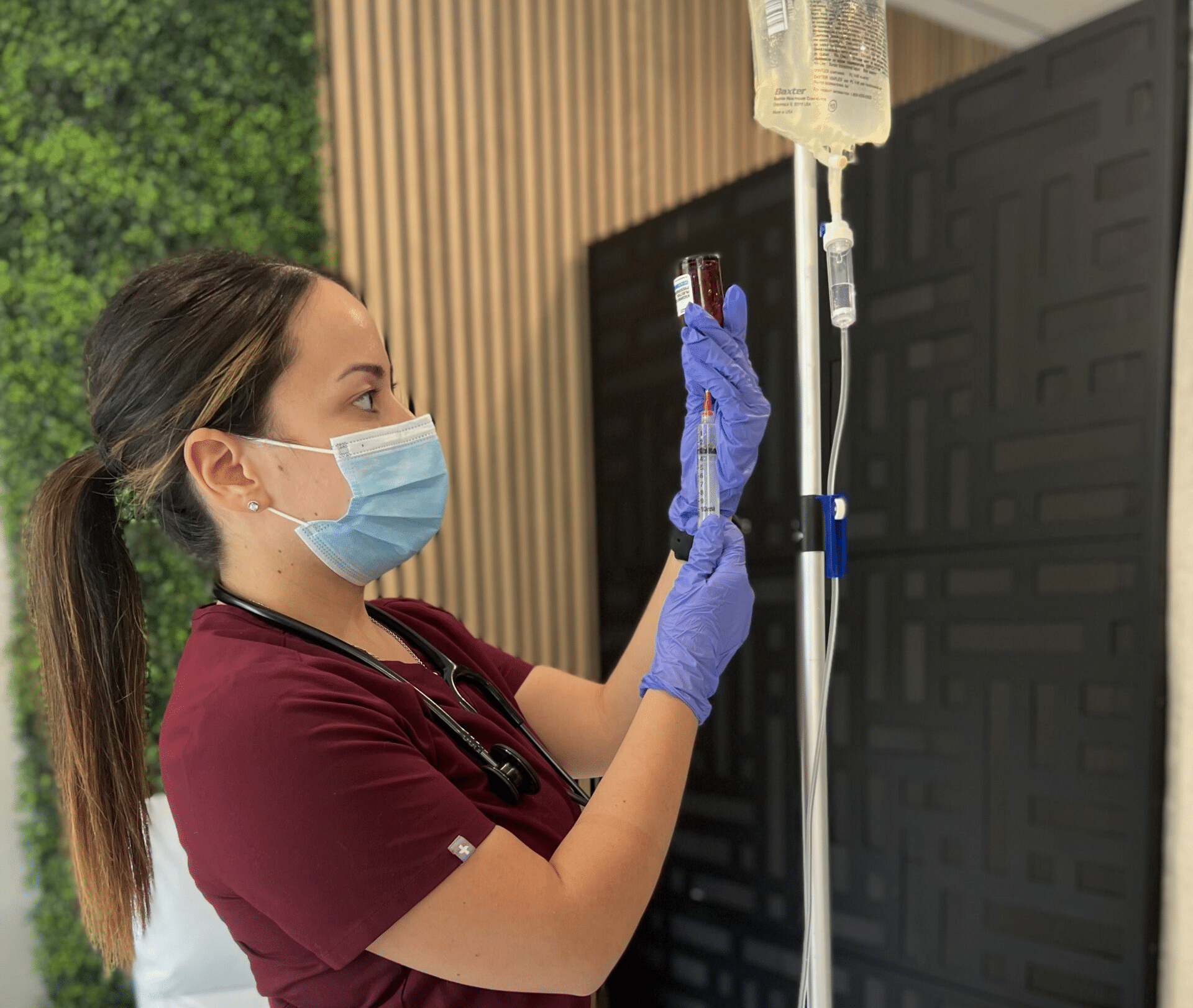 Nurse setting up an IV Therapy treatment for weight loss.