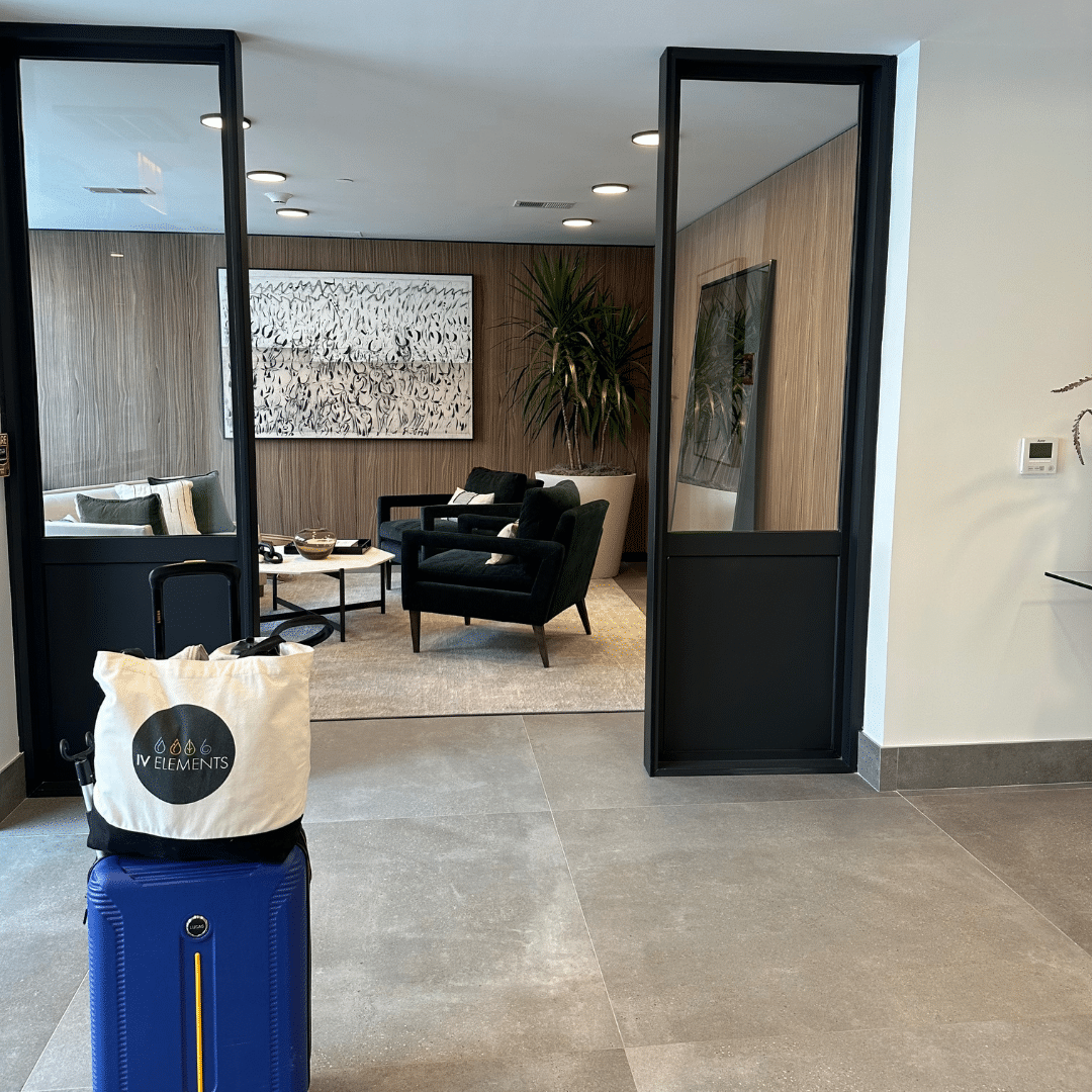 Waiting room with an IV Elements suitcase outside the room