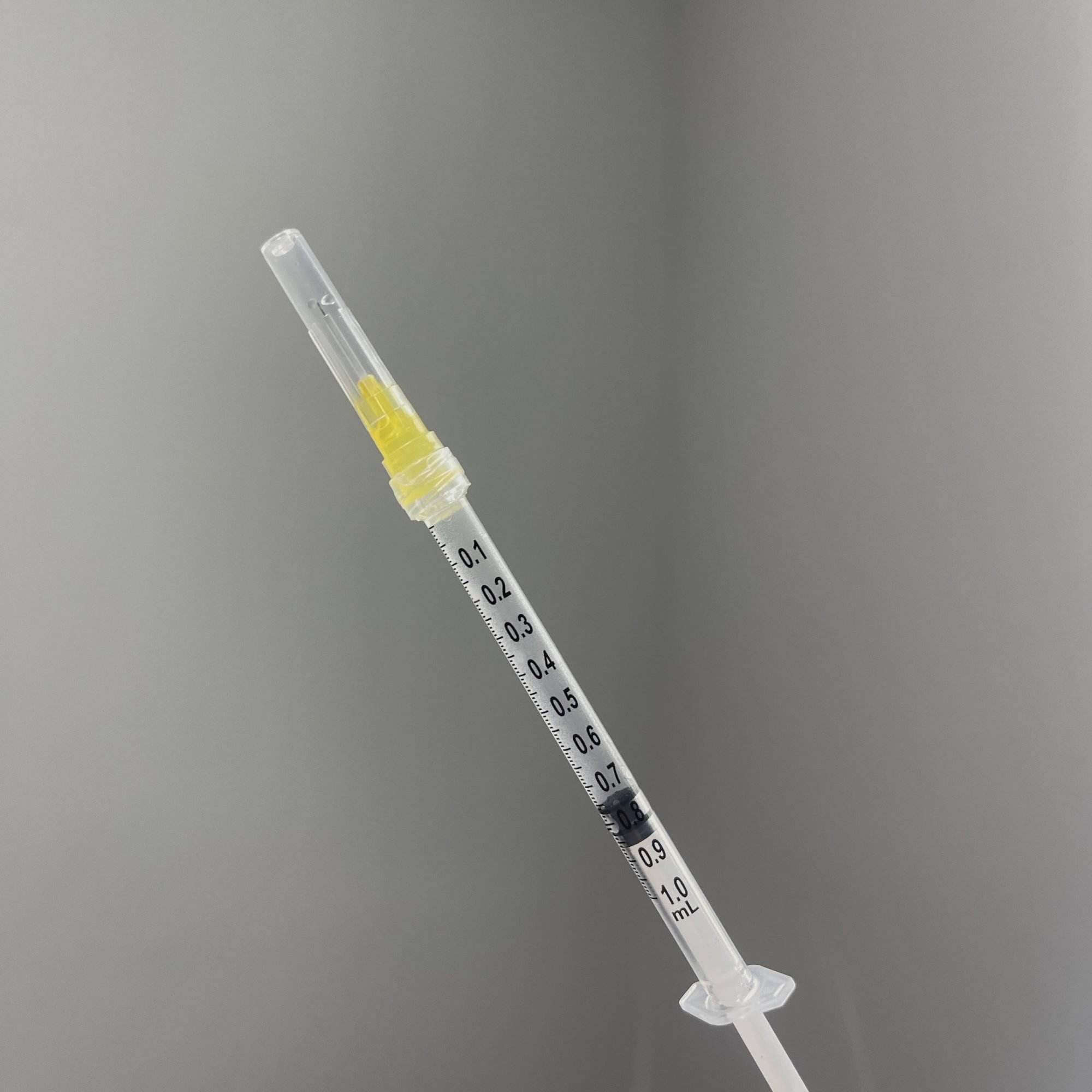 HCG injection needle with cap on
