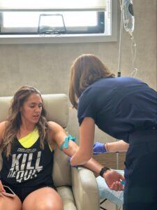 IV Elements nurse administering NAD+ IV therapy to client.
