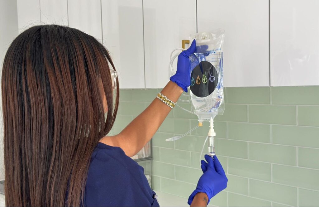 IV Elements nurse prepping chelation bag for client.