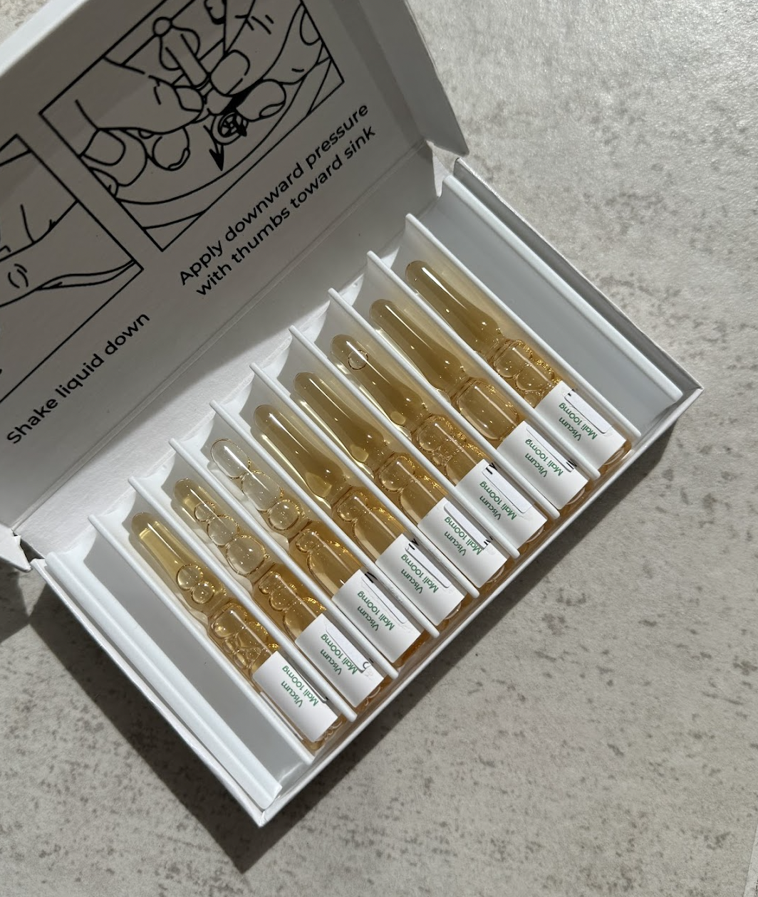 A box full of several IV treatments in glass vials