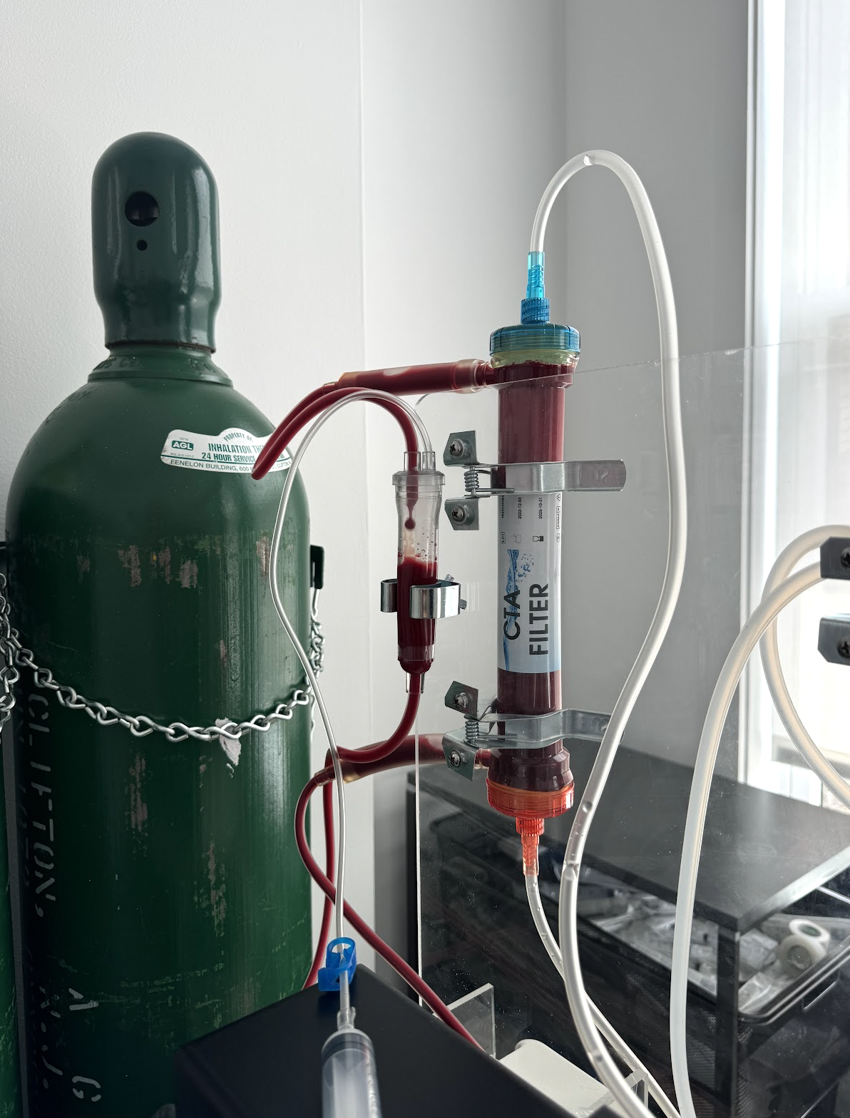 A green tank attached to a CTA filter