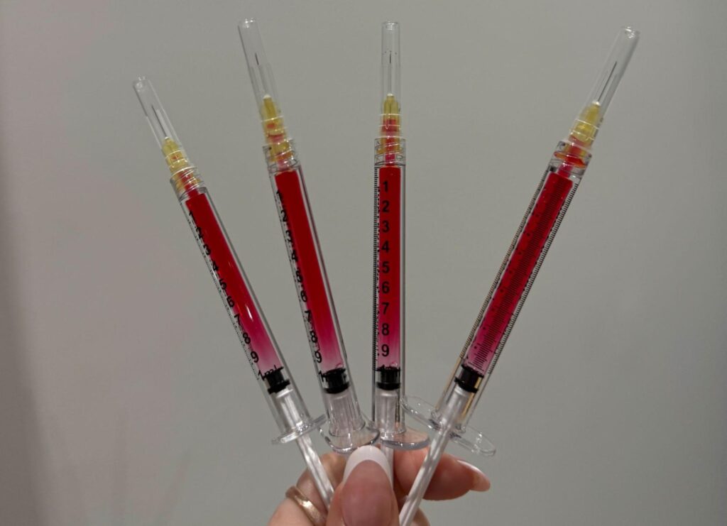IV Element nurse holding tirzepatide syringe.
