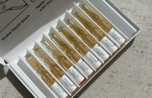 Mistletoe vials on a quarts counter top.
