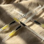 Semiglutide syringes on a blanket in the sunlight.