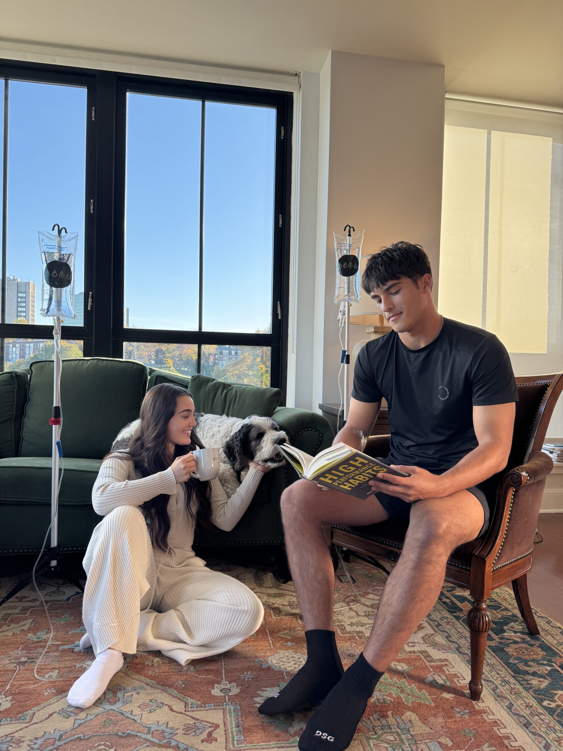 Two patients receiving an IV in their home