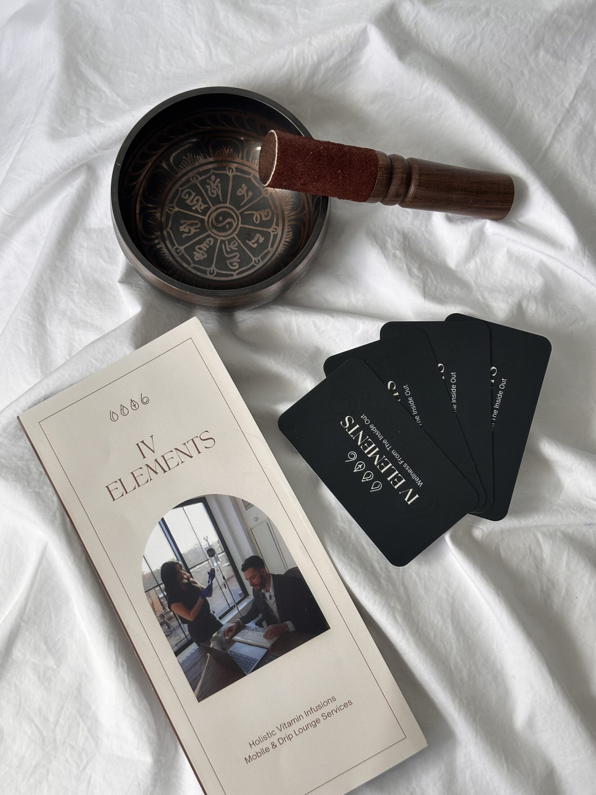IV Elements brochure and cards next to sound bowl