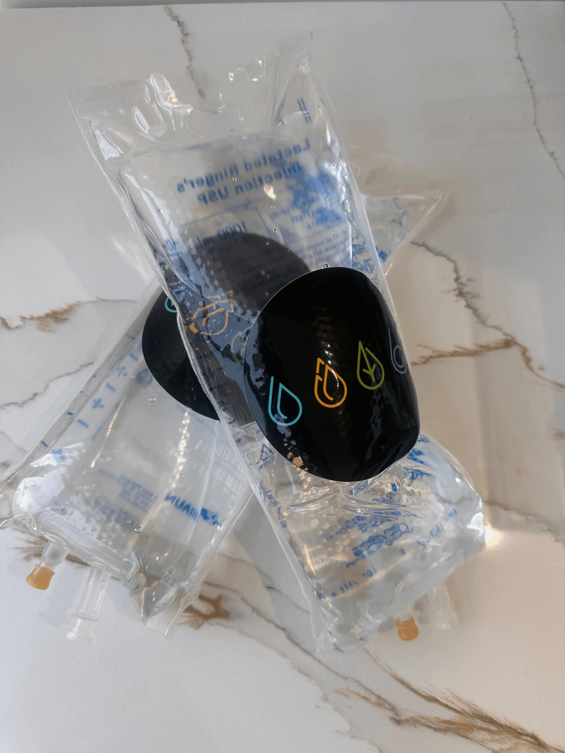 Two IV bags with IV Elements logo