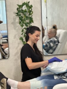 Nurse prepping patient for iron infusion.