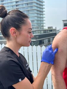 IV Elements certified mobile nurse giving Vitamin D injection to client.