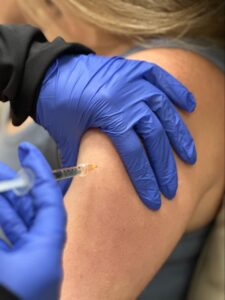 IV Elements nurse administering magnesium boost to client.